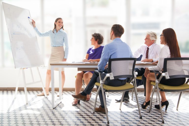Cheerful business coach explaining strategy