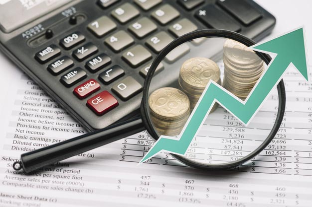 magnifying-glass-coin-stack-calculator-financial-report